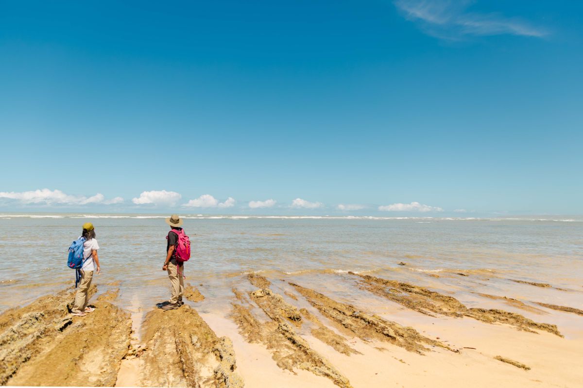 Geelkrans two hikers on the beach Geelkrans two hikers on the beach